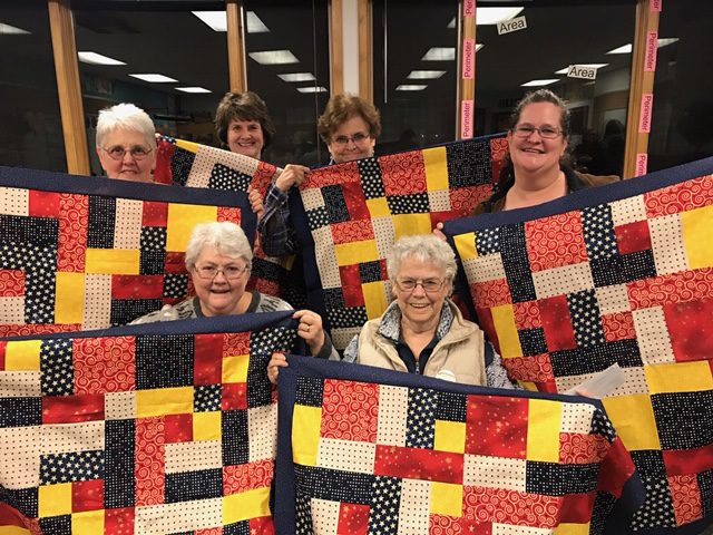 This image has an empty alt attribute; its file name is USSMTC-Piecemakers-w-New-Baby-Quilts-4-20.jpg